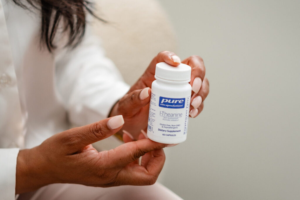 Hands holding a medicine bottle